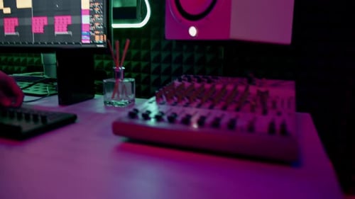 professional sound recording studio sound engineer or music producer sitting at the remote control