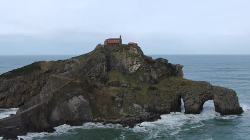Aerial orbit shot Gaztelugache is an islet in the Vizcaya town of Bermeo, Pais Vasco, Spain.