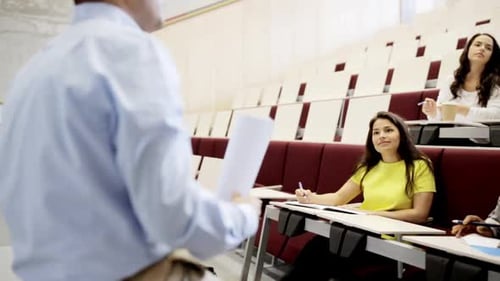 Group of International Students and Teacher with Papers in Lecture Hall African