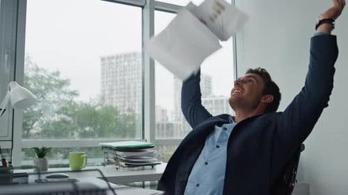 Happy Manager Throwing Papers Finishing Project. Joyful Businessman Lean Chair Relaxing After