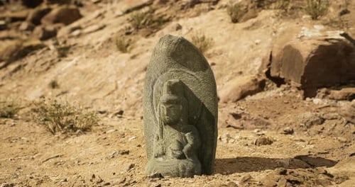 Ancient Deity Stone Sculpture Discovered in Arid Landscape