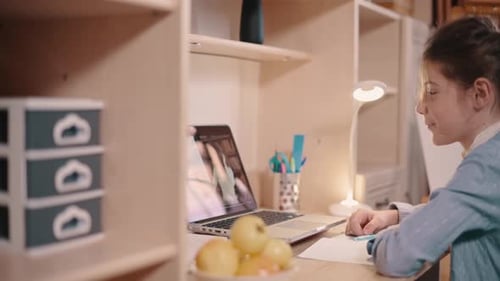 Girl Engaged in Online Learning at Home