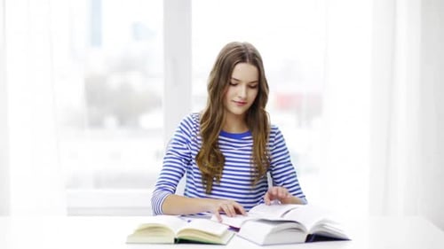 Education and Home Concept - Happy Smiling Student Girl with Books, Reading