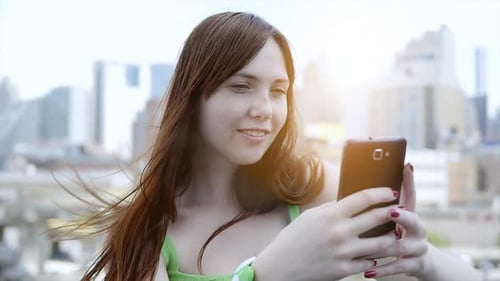 Woman Using Smartphone in the City