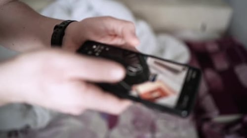 Man scrolling social media in smartphone