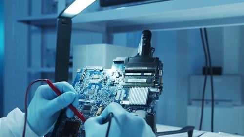 Microelectronics Engineer Works in a Modern Scientific Laboratory on Computing Systems and