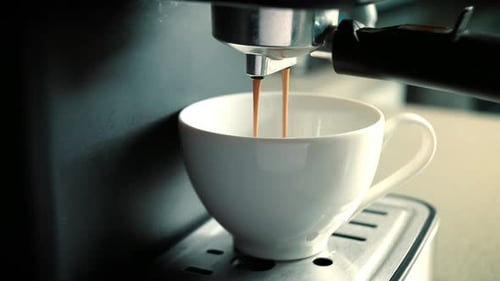 Pouring Coffee Stream From Machine in Cup Pouring Coffee Stream From Machine in Cup Flowing Fresh