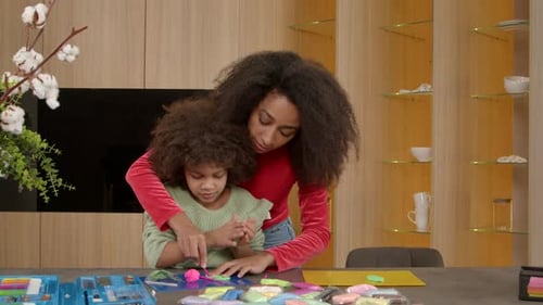 Adult and Child Creating Art with Modeling Clay