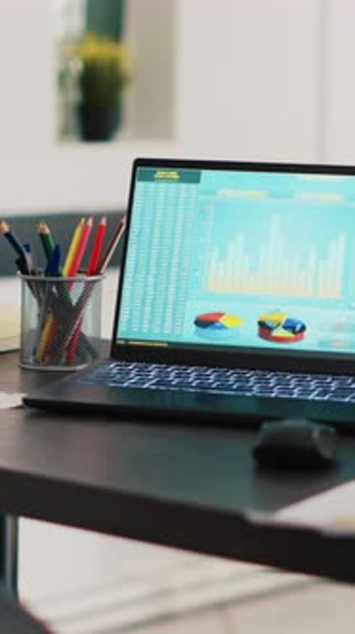 Vertical Video Financial Stock Market Diagrams with Charts and Stock Numbers on Laptop Showing
