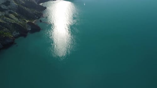 Aerial Panoramic View of Seascape with Crystal Clear Azure Sea and Rocky Shores