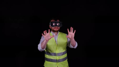Man Using Virtual Reality Headset with Reflective Vest