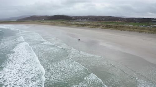 Aerial View of Hore Riding on Narin Beach During a Misty and Hazy Winter Day Portnoo County Donegal