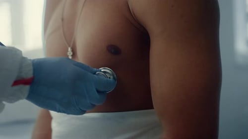 Doctor Hands Listening Heartbeat Ward Closeup. Medical Checkup During Pandemic. Unrecognized Physici