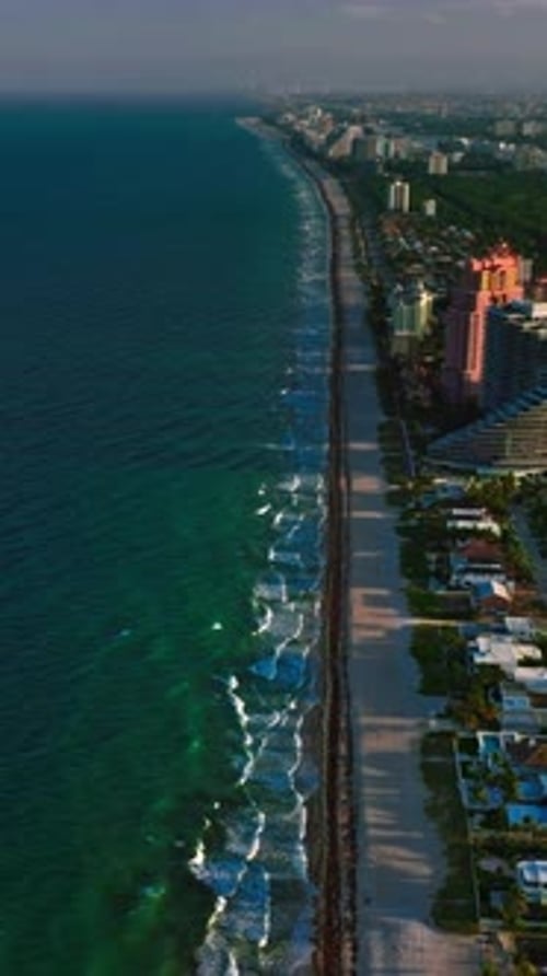Aerial view of Miami coastline showcasing vibrant ocean and cityscape