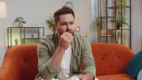 Man Takes Pill for Headache at Home