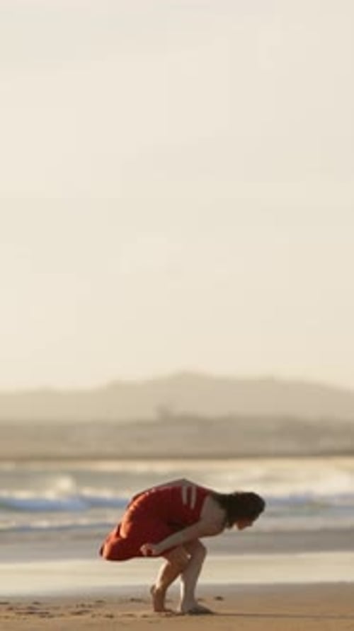 Young Woman Dancing on the Beach