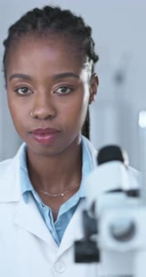 Young Adult Scientist in the Lab Looking at Camera