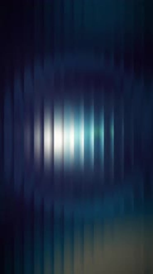 Seamless vertical UHD abstract light leak effect with soft blue and green hues fading