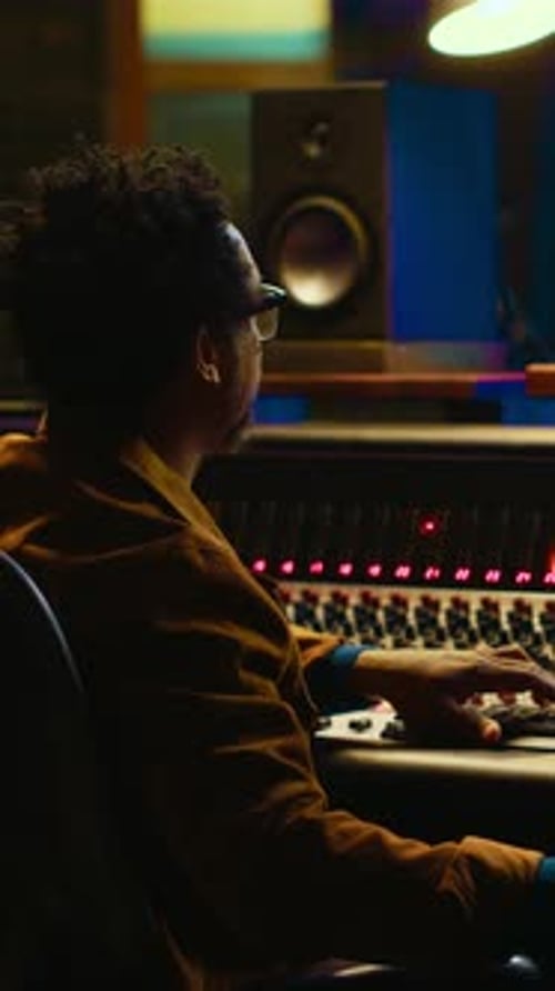 Young Man Works in Recording Studio