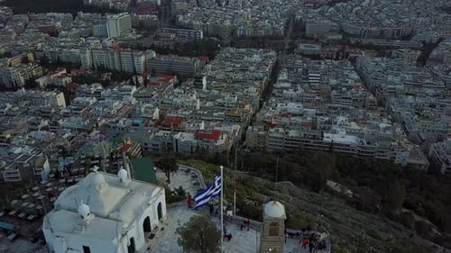 Aerial drone shot coming over top of Mount Lycabettus in Athens Greece, 4K.