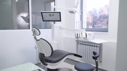 Dental Chair in Stomatology Office with Professional Modern Equipment Dentist's Office Interior with