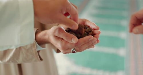 Ramadan kareem, islam and date with hands of people in mosquito for iftar