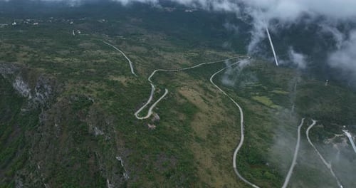 Winding Road In The Mountain On A Foggy Day In Cetinje, Montenegro. - aerialshot