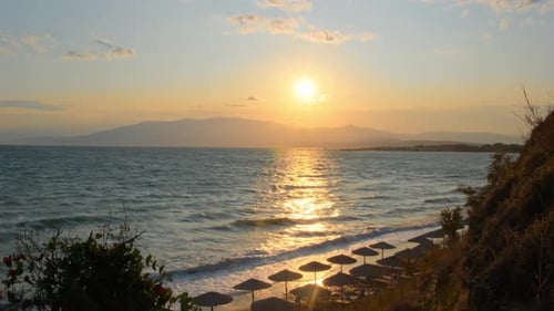 Seascape ocean and beautiful view of sea tropical beach through thatched umbrellas