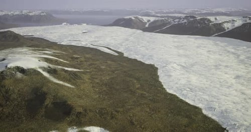 Ice Cap Melting Over Rocky Terrain in a Remote Mountainous Region