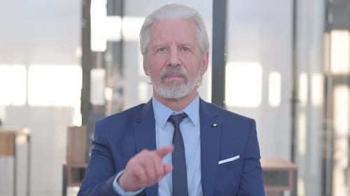 Senior Man Denies Concept with Finger