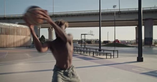 Black Basketball Player Preparing to Throw Ball