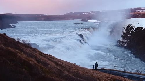 Woman Stand By Stunning Gulfoss Waterfall (Zoom In)