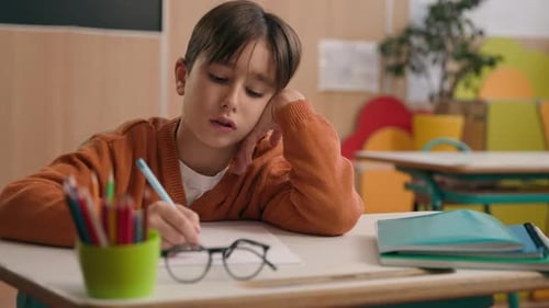 School Class Lesson Tired Boring Concentrated Caucasian Boy Son Child Kid Studying Learning in