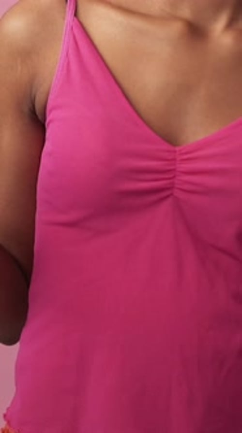 Glamorous Woman Smiles Wearing Colorful Earrings