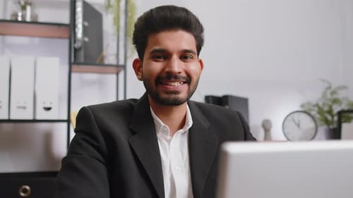 Closeup Businessman Freelancer at Office Workplace Working on Laptop Computer Sends Online Messages