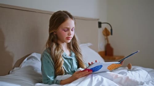 Makeup Kid Reading Book Relaxing Under White Blanket Closeup Small Girl Resting