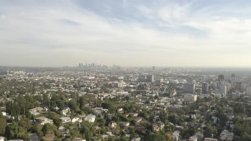 4K flight over the Hollywood Hills with the downtown Los Angeles skyline in the background.