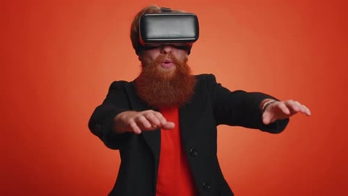 Young Adult Wearing VR Headset, Orange Background