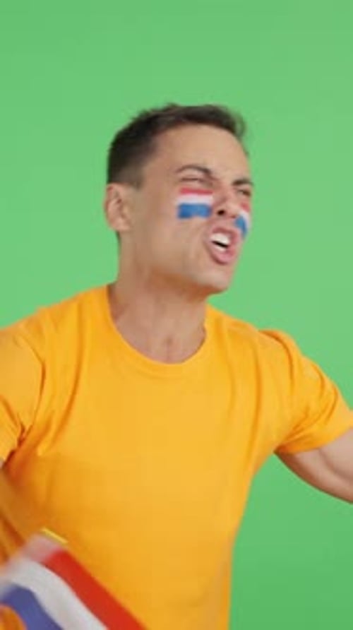 Excited Sports Fan Cheering and Waving Flag