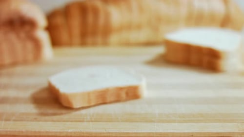 Sliced Loaf of White Bread on Cutting Board