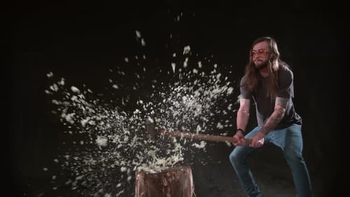 Man Smashes Glass Ball with Sledgehammer in Slow Motion