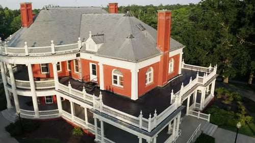 Aerial view flying backwards, away from the Roger Williams park casino building.