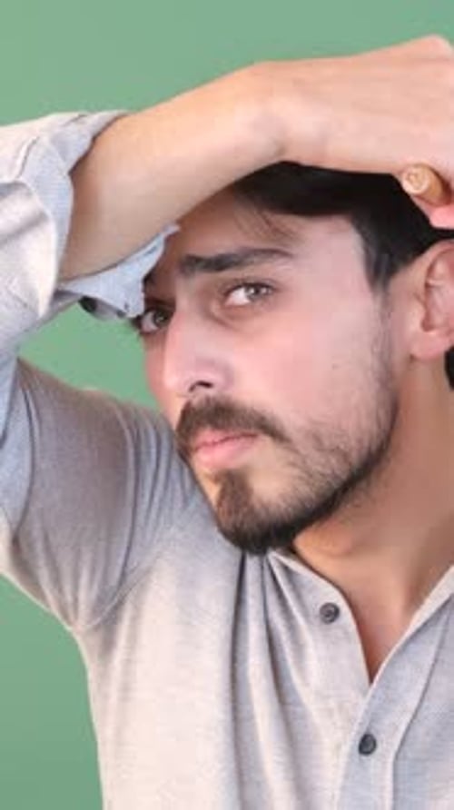Young Adult Male Brushing Hair
