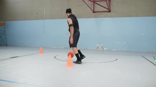 Men Play Basketball In Indoor Court