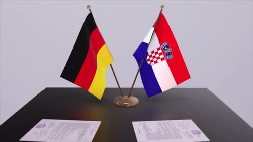 German and Croatian Flags with Contracts on a Table