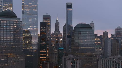 New York City Financial District Glowing Warmly in Lower Manhattan Skyscrapers Lighting Up During