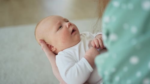 Happy Family at Home Mother Hands Holding Little Toddler Child Daughter Mom and Baby Girl Relax