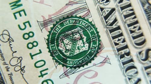 A Tendollar Paper Bill Rotates in Closeup