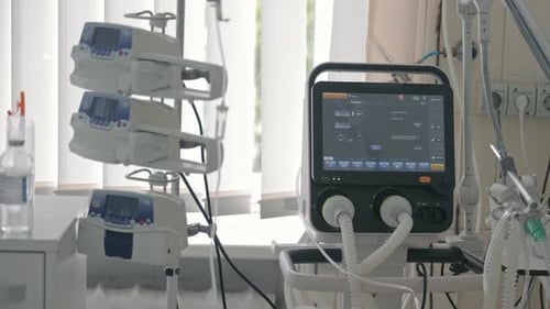 Modern Medical Ventilator Machine and Infusion Pump System in Hospital Intensive Care Unit Room for