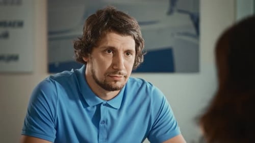 Charismatic Man Talking to a Female Colleague in the Office Work Matters are Discussed During